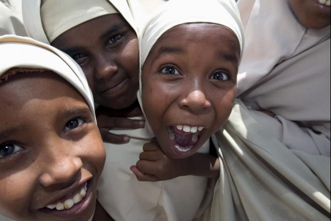 Primary school students are eager to have their photograph taken in Galkayo, Somalia. In the past, education was free in Somalia from primary school to university. Primary school students in Galkayo. Photo credit: Petterik Wiggers.