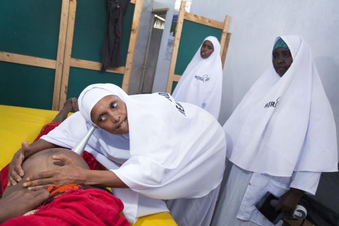 The health center is run by a local organization, Humanitarian Initiative Just Relief Aid (HIJRA). Trained medical staff care for more than 100 patients a day. For pregnant women, the health center provides a safe place to give birth. Shukri Abdul-Kadir Ahmed, a nurse at a health center in Badbaado camp, Mogadishu, listens for a baby’s heartbeat. Badbaado shelters 28,000 people who have fled conflict or drought. Photo: Petterik Wiggers.