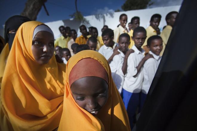 Attendance is free for students. School principal Sayed Farah Dirie, 25, says all the teachers are volunteers. Sayed earns an income from private tutoring in the evenings so he can buy second-hand schoolbooks and materials for students to use. Students at General Daud School in Mogadishu. Three hundred students ranging from six to 25 years old attend General Daud School in Mogadishu. Photo: Petterik Wiggers.