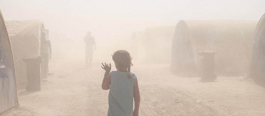 A dust storm in Al Tinah camp, Iraq. In September 2016, Oxfam and local partners distributed water and sanitation materials to displaced families living in this small camp of 200 tents and to hosting communities. Photo: Amy Christian/Oxfam A dust storm in Al Tinah camp, Iraq. In September 2016, Oxfam and local partners distributed water and sanitation materials to displaced families living in this small camp of 200 tents and to hosting communities. Photo: Amy Christian/Oxfam