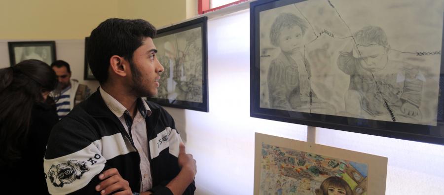 17 year old Hamza Shaheen and his family had to flee their home to escape the bombing. Oxfam's partner, the Culture and Free Thought Association (CFTA) encouraged him to paint about what he went through. Photo: Oxfam 17 year old Hamza Shaheen and his family had to flee their home to escape the bombing. At CFTA he was encouraged to paint about what he went through. Photo: Oxfam