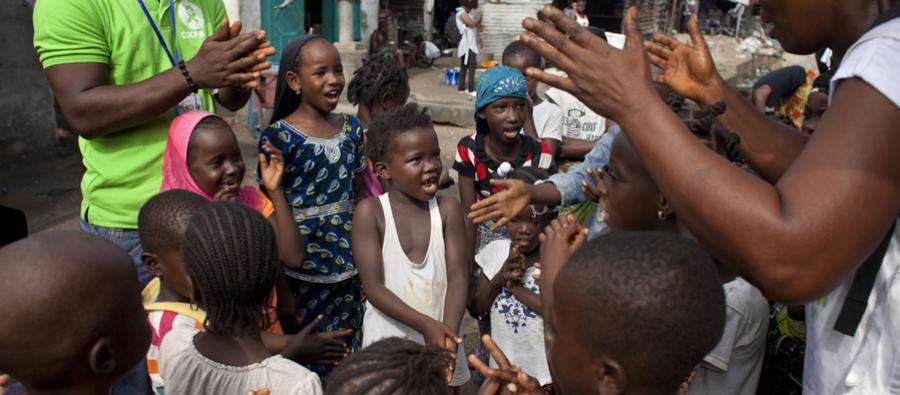 Oxfam Community Support Workers teach children in West Point, Monrovia, how important it is to wash your hands to help prevent contracting Ebola. Photo: Abbie Trayler-Smith/Oxfam Oxfam Community Support Workers teach children in West Point, Monrovia how important it is to wash your hands to help prevent contracting Ebola. Photo: Abbie Trayler-Smith