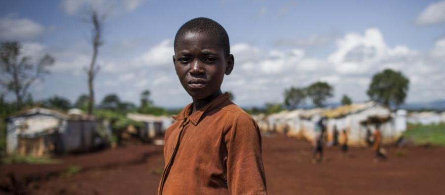 A young refugee from Burundi stands in the Nyarugusu refugee camp in Tanzania on March 26, 2016. According to UNHCR, Nyarugusu is “one of the largest and most overcrowded refugee camps in the world”, currently hosting over 140,000 refugees. A young refugee from Burundi stands in the Nyarugusu refugee camp in Tanzania on March 26, 2016. According to UNHCR, Nyarugusu is “one of the largest and most overcrowded refugee camps in the world”, currently hosting over 140,000 refugees.