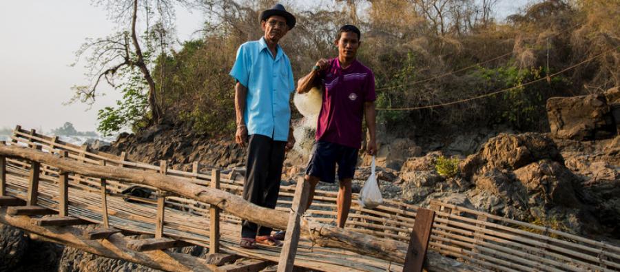 A 67 year old local fisherman stands by the Mekong river, Loas. He has participated in a program to pass his skills on to the next generation. Photo: Savann Oeurm A fisherman stands by the Mekong river, Loas.