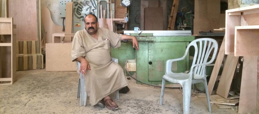 Anwar sits in his furniture workshop in Gaza. The blockade has ground his business to a halt. Photo: Sami Alhaw/Oxfam Anwar sits in his furniture workshop in Gaza. Photo: Sami Alhaw/Oxfam