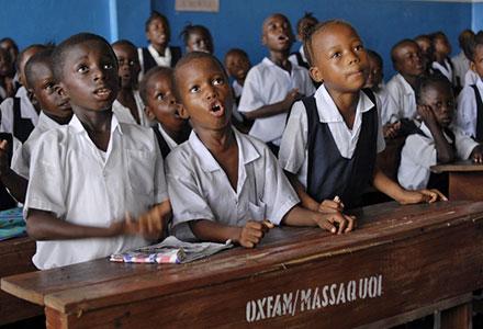 (Left to right): Emanuel Kun (7), Nush Gunror (5) and Kumba Lamie (8) during their 'numbers and letters' class (pre-primary) at N. V. Massaquoi School, West Point, Monrovia, Liberia. Photo credit: Aubrey Wade/Oxfam (Left to right): Emanuel Kun (7), Nush Gunror (5) and Kumba Lamie (8) during their 'numbers and letters' class (pre-primary) at N. V. Massaquoi School, West Point, Monrovia, Liberia. Photo credit: Aubrey Wade/Oxfam