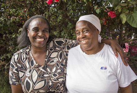 Friends Susan Wairimu, 50, and Sarah kuria, 63, at a Wezesha Jamii meeting in Kawangware, an informal settlement in Nairobi, Kenya. Photo: Katie G. Nelson/Oxfam Friends Susan Wairimu, 50, and Sarah kuria, 63, at a Wezesha Jamii meeting in Kawangware, an informal settlement in Nairobi, Kenya. Photo: Katie G. Nelson/Oxfam